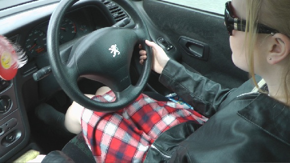 Girl-driving-car-in-leather-gloves-and-jacket-emily