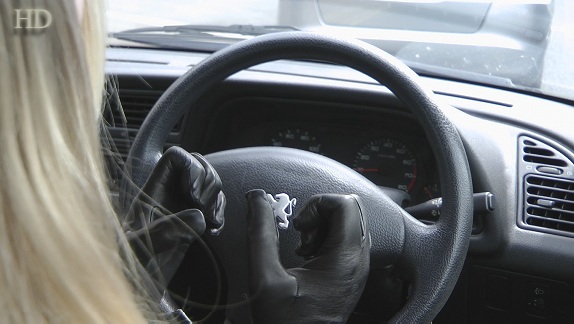 emily-girl-in-tight-leather-gloves-driving-car